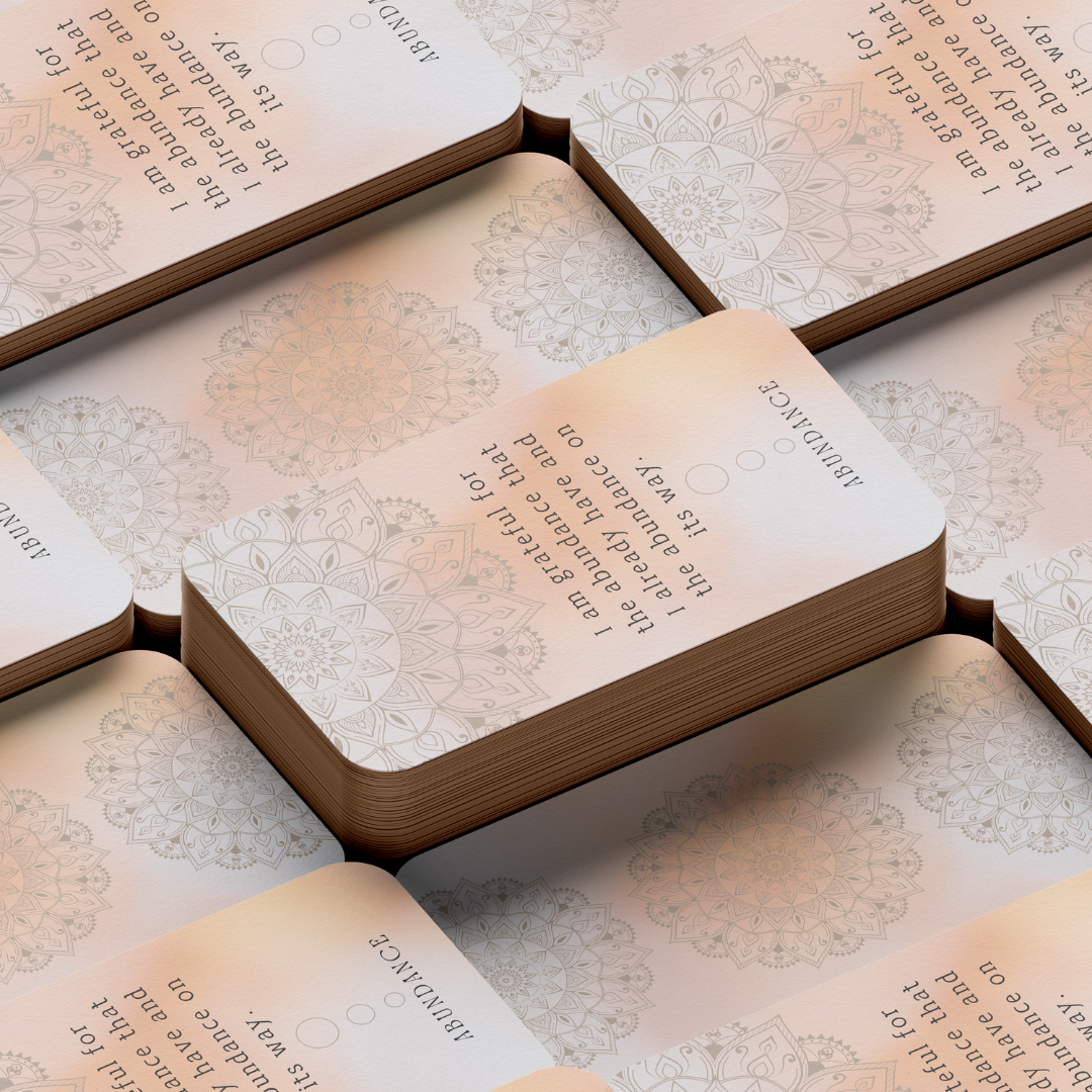 Set of spiritual cards with mystical artwork and messages.