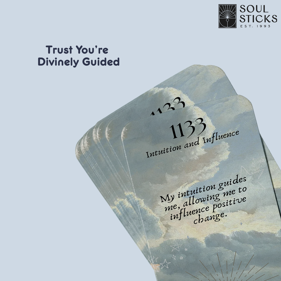 Set of spiritual cards with mystical artwork and messages.