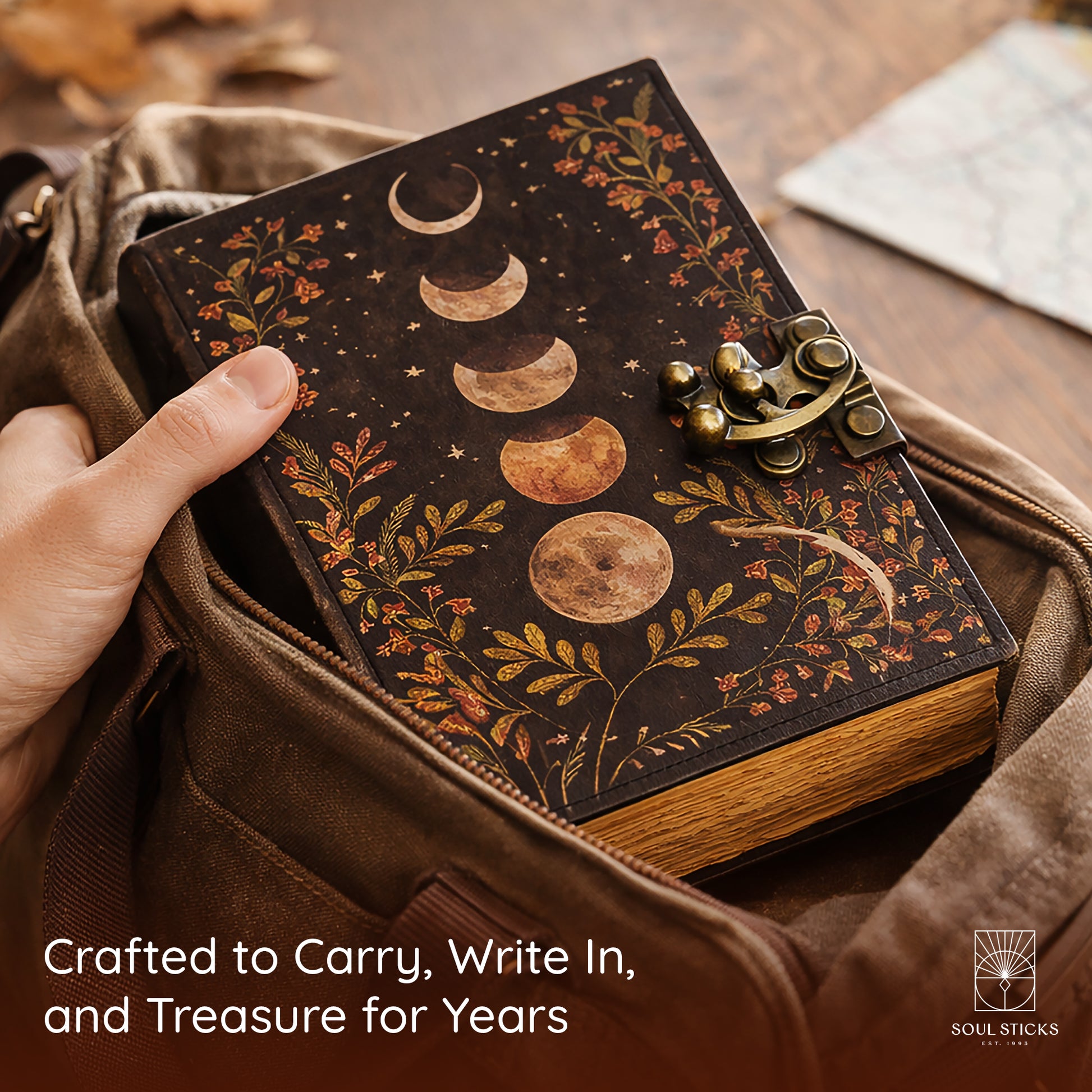 Closed Multi Moon leather journal resting on a fabric surface