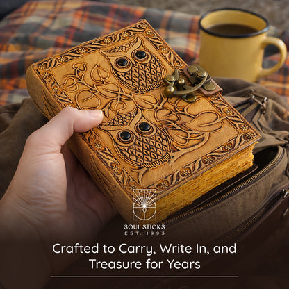 Angled view of the Owl leather journal in a lifestyle setting