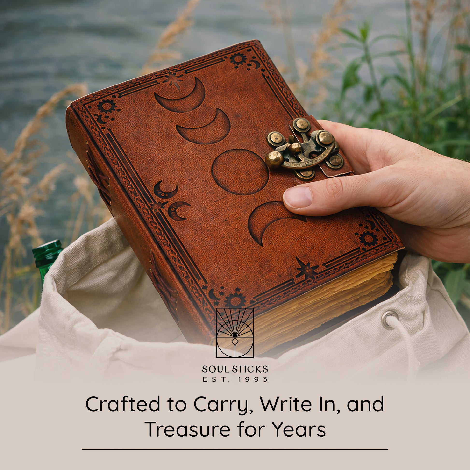 Angled view of the Sun & Moon leather journal in a lifestyle setting