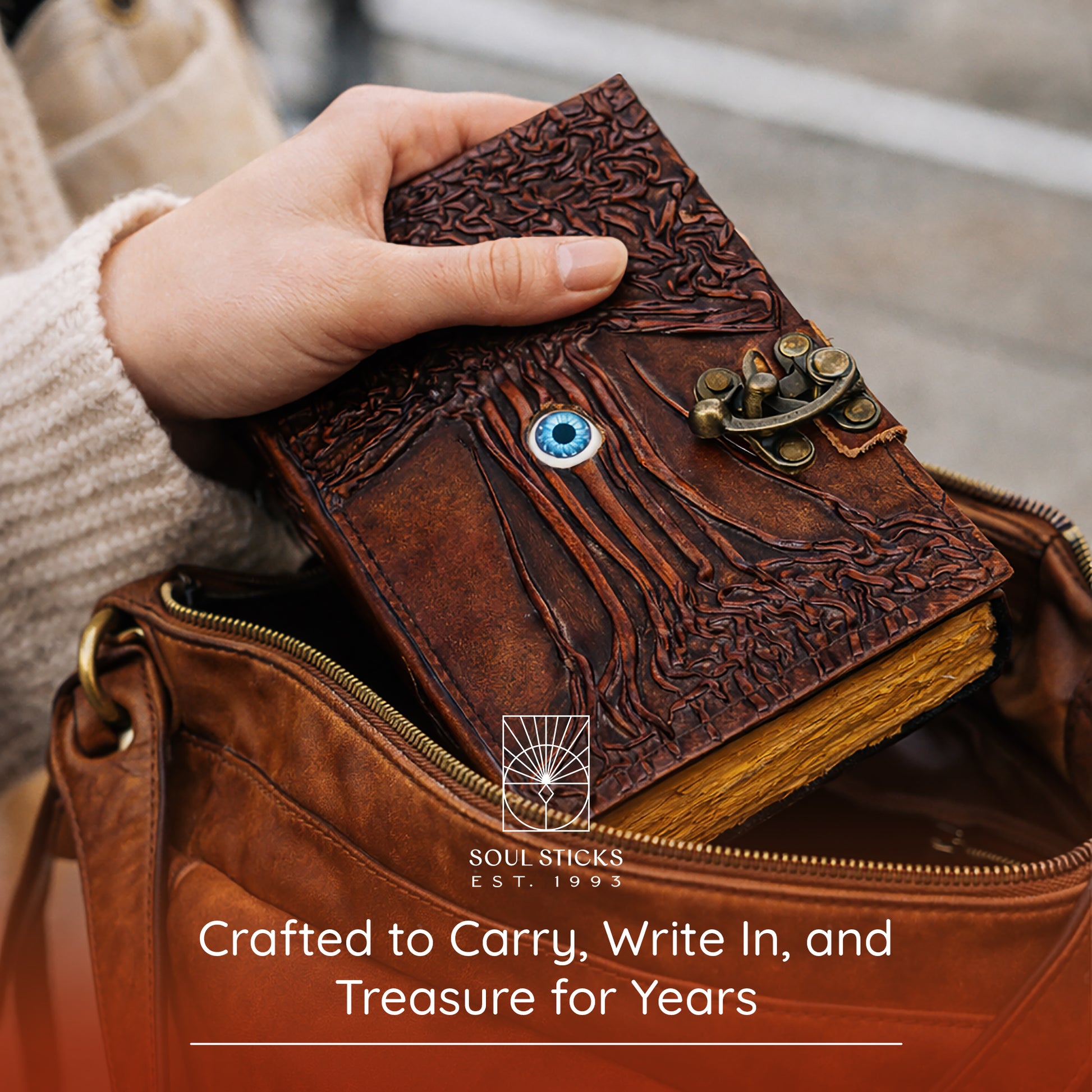Angled view of the Evil Eye Tree leather journal in a lifestyle setting