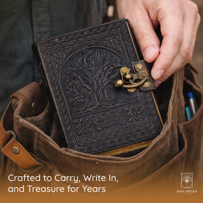 Angled view of the Tree of Life leather journal in a lifestyle setting