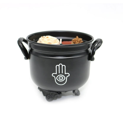Mini cast iron cauldron designed for rituals, meditation, and energy cleansing.