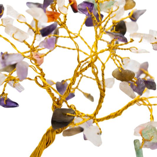 Decorative string with multicolored stones on a white background