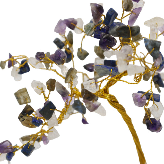 Decorative branch with multicolored stones on a white background