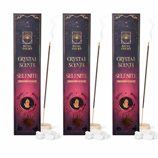 Three packages of Crystal Scents Selenite incense sticks on a white background