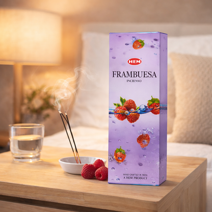 HEM Raspberry incense sticks box on a bedside table with incense burner and fresh raspberries
