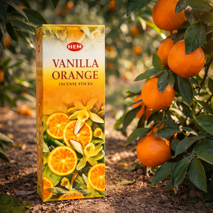 HEM Vanilla Orange incense sticks box beside oranges on an orange tree