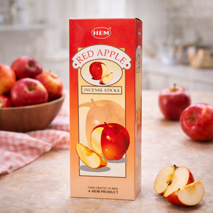 HEM Red Apple incense sticks box with fresh apples and sliced apple on a kitchen counter