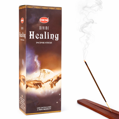HEM Divine Healing incense sticks box with burning incense on white background