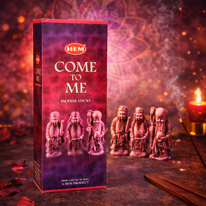 HEM Come to Me incense sticks box with figurines, burning incense, and candlelight