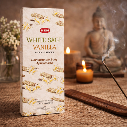 HEM White Sage Vanilla incense sticks box with burning incense and candles near Buddha decor