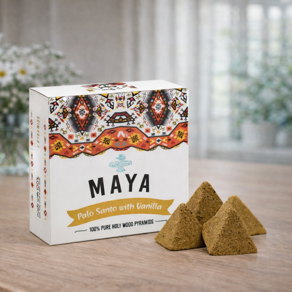 Maya Palo Santo with Vanilla packaging on a wooden surface with two pyramids of incense.