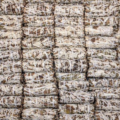 Stacks of wood bundles tied together with white twine