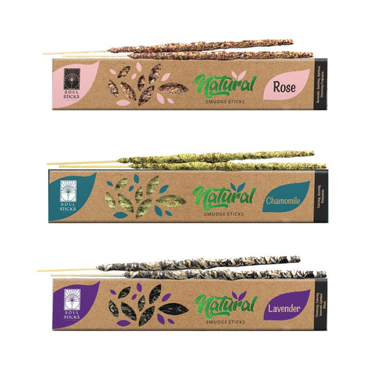 Three packages of natural smudge sticks, each labeled with a different herb name: Palo Santo, Copal, and White Sage. Each package showcases the sticks rolled in herbs at the bottom.