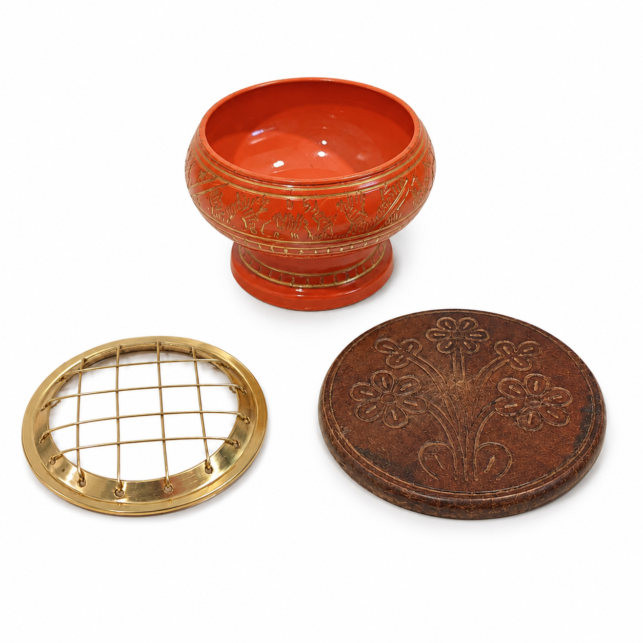 Orange incense burner set with gold detailing, removable brass screen top, and round carved wooden coaster, shown as three separate pieces on a white background.
