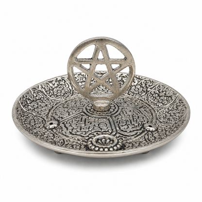 Antique silver pentacle incense holder with ornate floral engravings and a raised pentagram centerpiece on a white background.
