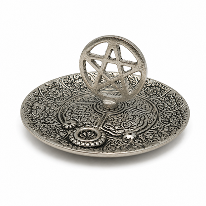 Antique silver pentacle incense holder with ornate engraved floral details and an upright pentagram centerpiece.