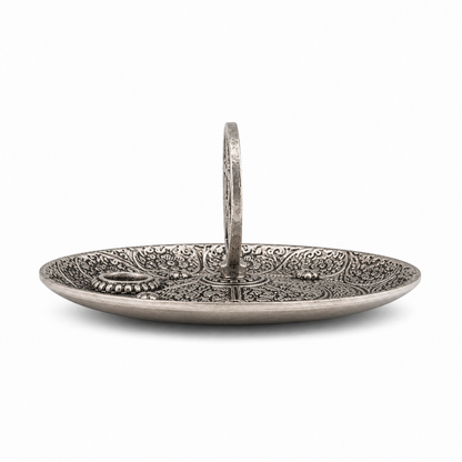 Antique silver pentagram incense holder shown from the side, featuring an ornate engraved round dish and upright pentacle centerpiece.