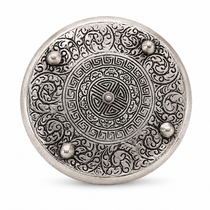 Bottom view of ornate silver pentacle incense holder featuring detailed engraved patterns and four raised feet on a white background.