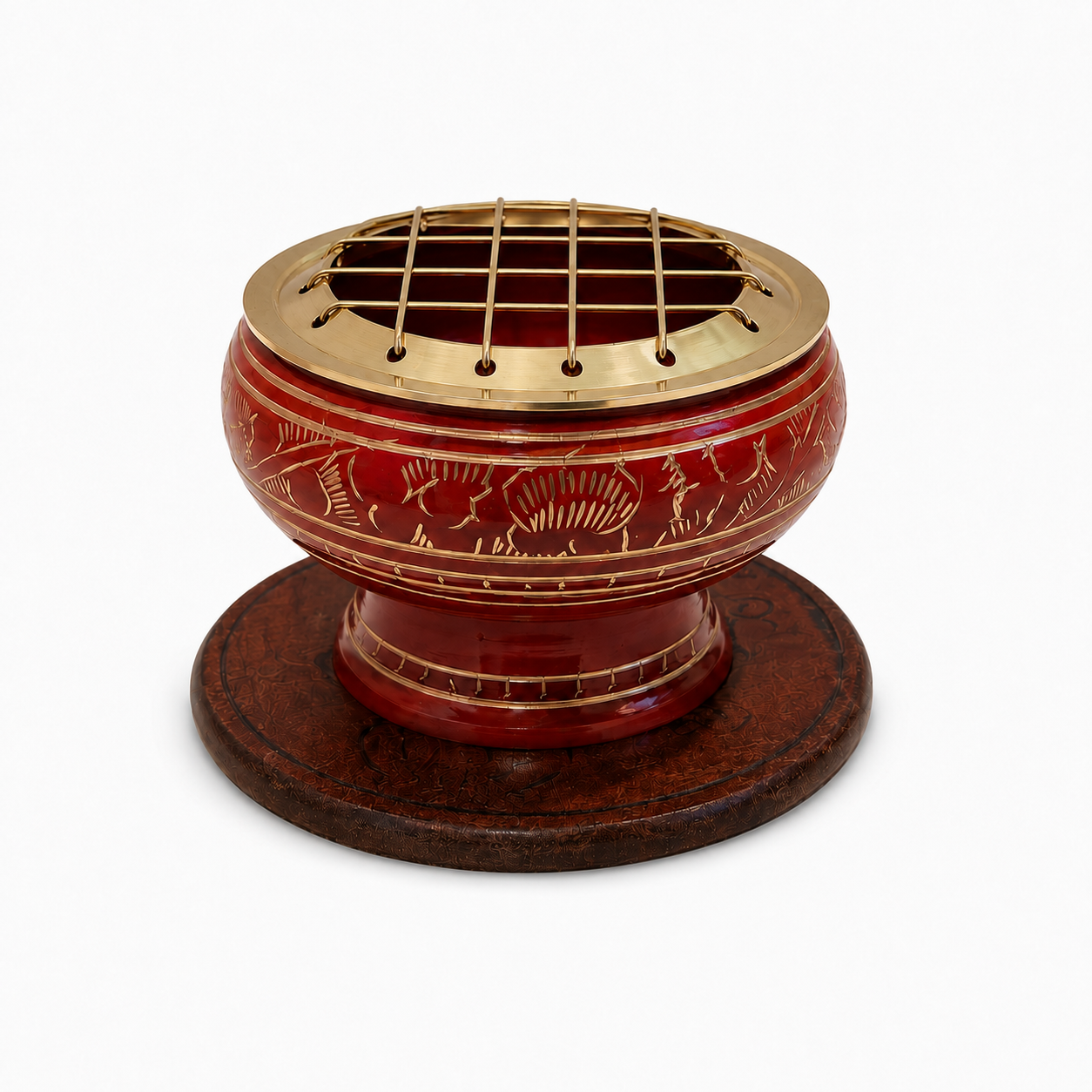 Red decorative incense burner with gold detailing and a brass screen top, displayed on an ornate round wooden coaster against a white background.