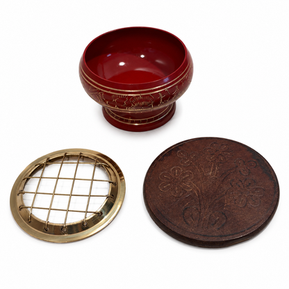 Red incense burner set with gold detailing, removable brass screen top, and round carved wooden coaster, shown as three separate pieces on a white background.