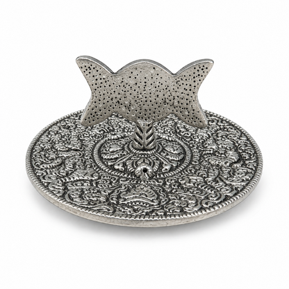Antique silver Triple Moon pentacle incense holder with ornate floral detailing and raised stand on a white background.