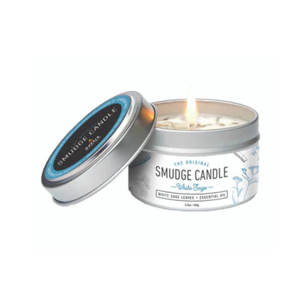 Smudge candle in a tin with a lit candle inside on a white background