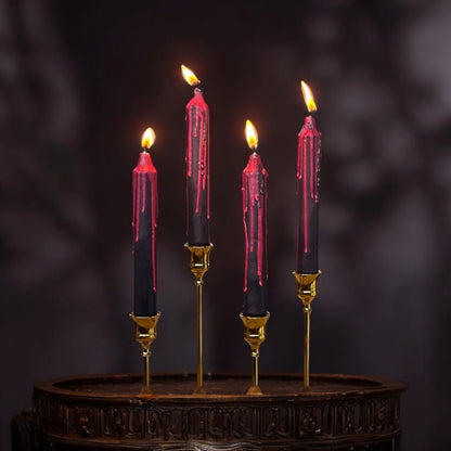 Decorative ritual bleeding candle with dripping wax for magical and mystical intentions.
