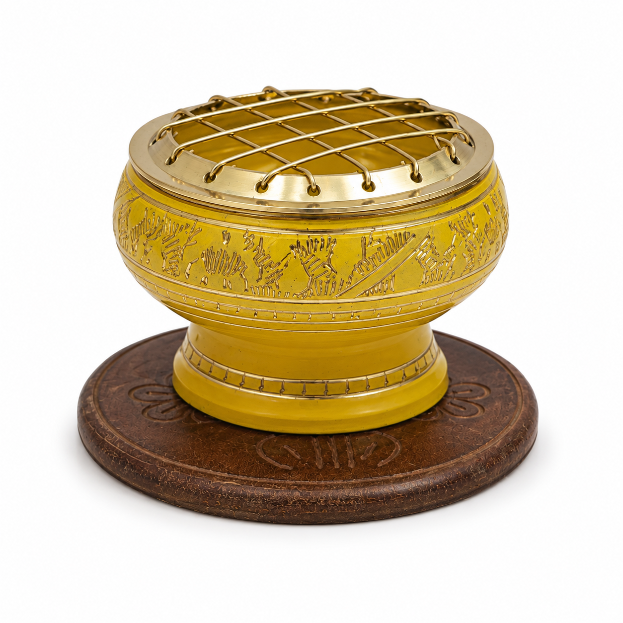 Yellow decorative incense burner with gold detailing and a brass screen top, displayed on an ornate round wooden coaster against a white background.