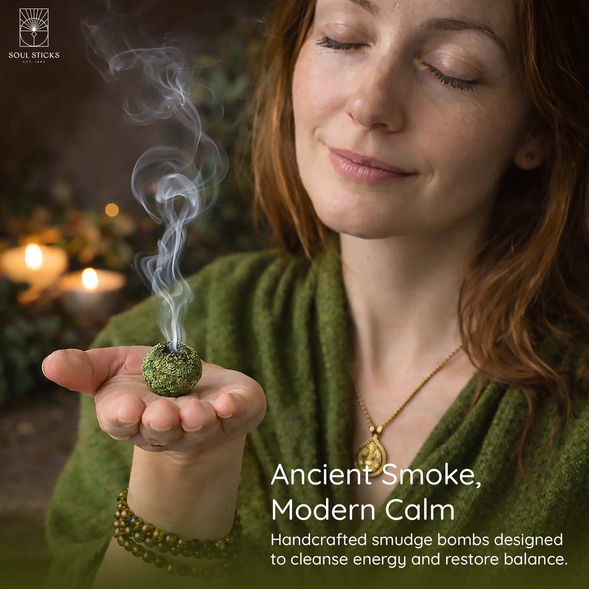 Hand holding a lit sweetgrass braids smudge bomb with smoke