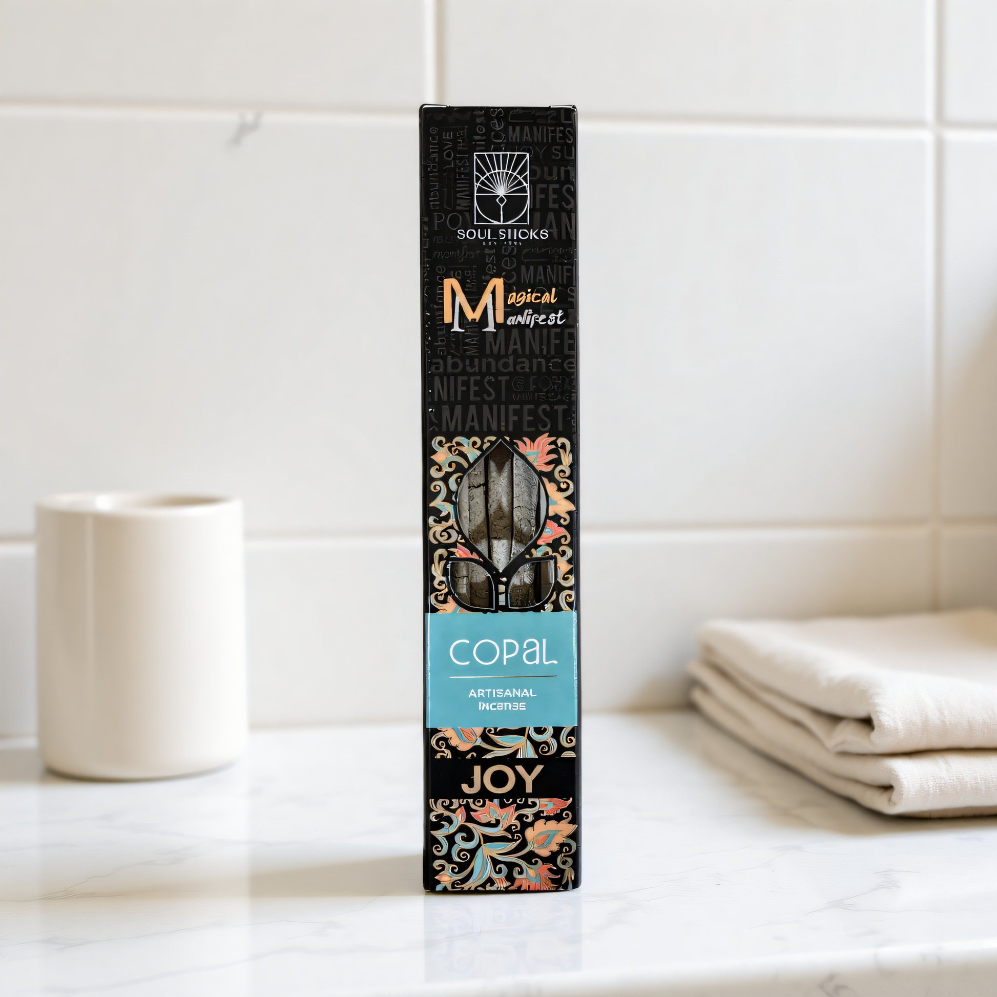 Magical Manifest Copal Incense on a bright white marble vanity with clean spa styling